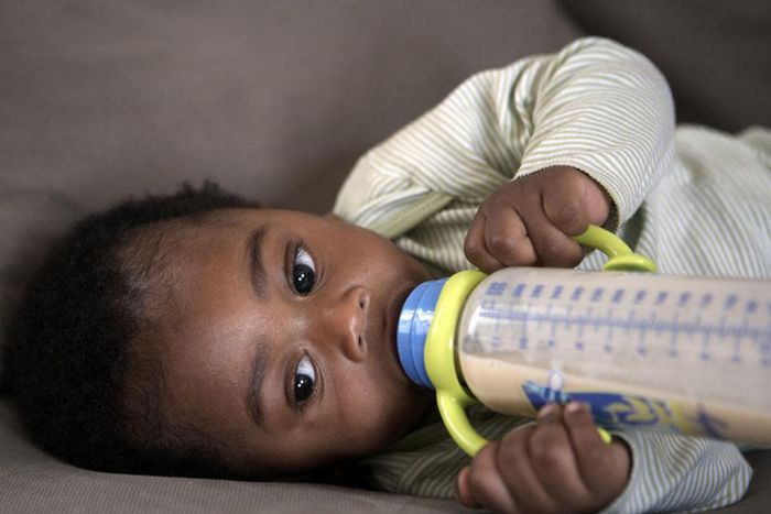 Baby feeding from a bottle
