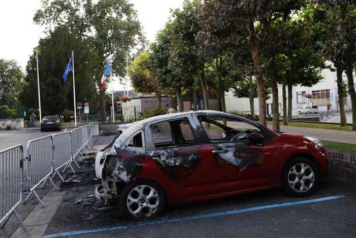 Cars burned north of Paris in 3rd night of tension over death in police hands