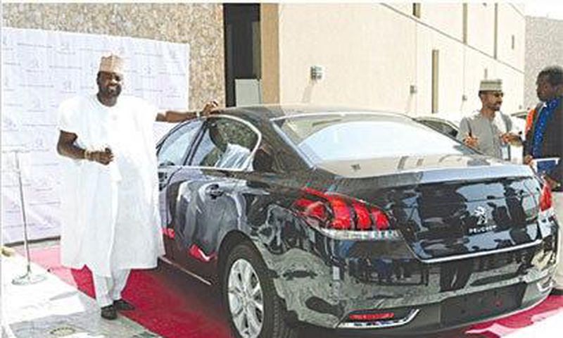 Kunle Afolayan, with his new Peugeot 508