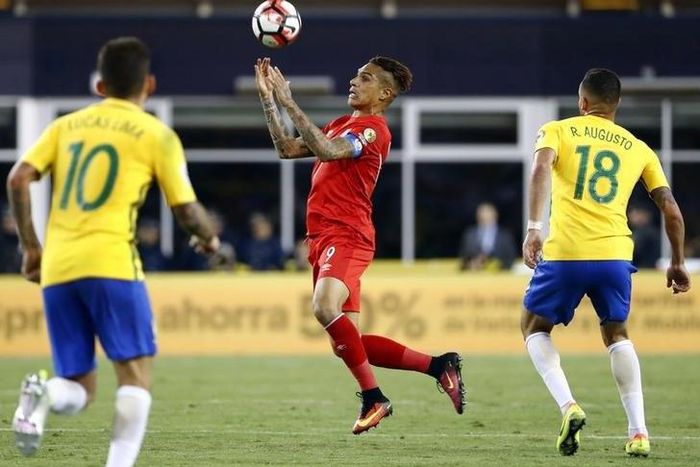 Foxborough, MA, USA; Peru forward Jose Paolo Guerrero (9) controls the ball between Brazil midfielder Lucas Lima (10) and Brazil midfielder Renato Augusto (18) during the second half of Peru's 1-0 win over Brazil in the group play stage of the 2016 Cop...