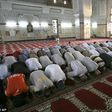 Worshippers praying in a mosque.
