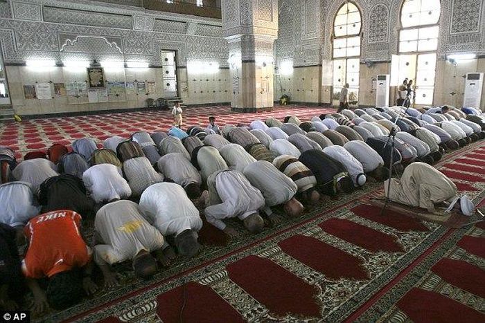 Worshippers praying in a mosque.