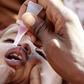 A newly arrived Somali refugee child receives a polio drop at the Ifo extension refugee camp in Dadaab, near the Kenya-Somalia border, August 1, 2011.   REUTERS/Thomas Mukoy