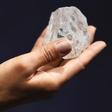 A model shows off the 1109 carat "Lesedi La Rona", the largest gem quality rough diamond discovered in over 100 years during a sale preview at Sotheby's auction house in London, Britain, June 14, 2016. REUTERS/Dylan Martinez