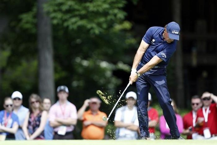 Phil Mickelson hits the ball out of the hole nine fairway during the final round of The Memorial Tournament at Muirfield Village Golf Club.