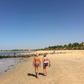 Tourists take a morning stroll along the beach in Saly, a coastal resort town in Senegal popular with Western tourists, March 15, 2016. REUTERS/Edward McAllister