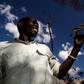 Yao honey-hunter Orlando Yassene holds a wild greater honeyguide female, temporarily captured for research, in the Niassa National Reserve, Mozambique, in this handout picture released July 21, 2016.