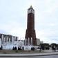 People sit in front of the clock tower at the end of Avenue Habib Bourguiba in Tunis, Tunisia, February 13, 2016.