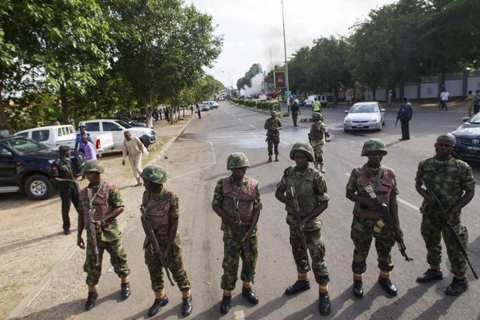 Nigerian army soldiers stand guard in Abuja June 25, 2014.