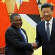 Chinese President Xi Jinping (R) and Mozambican President Filipe Nyusi shake hands at a signing ceremony at the Great Hall of the People in Beijing, China, May 18, 2016.