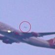A UFO spotted overtaking a Virgin Atlantic plane taking off from JFK Airport