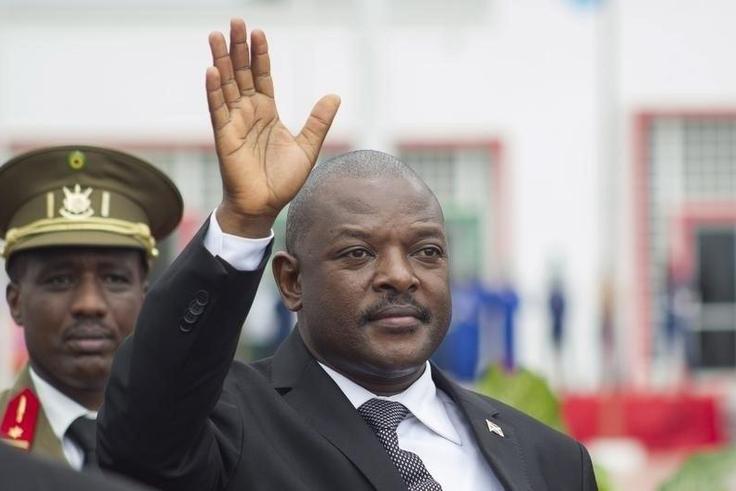 Burundi's President Pierre Nkurunziza bids farewell to his South African counterpart Jacob Zuma (not in the picture) as he departs at the airport after an Africa Union-sponsored dialogue in an attempt to end months of violence in the capital Bujumbura,...