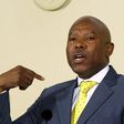 South African Reserve Bank governor (SARB) Lesetja Kganyago gestures during a media briefing in Pretoria, October 6, 2014.   REUTERS/Siphiwe Sibeko