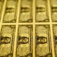 United States one dollar bills are seen on a light table at the Bureau of Engraving and Printing in Washington in this November 14, 2014, file photo. REUTERS/Gary Cameron/Files