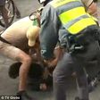 Man who tried to steal Olympic torch is seen being restrained