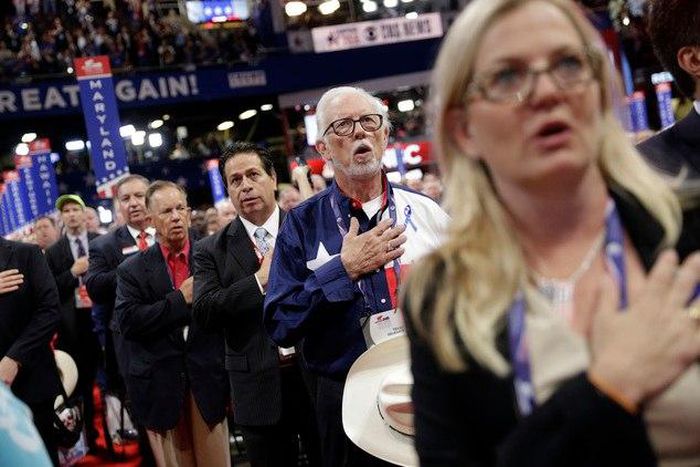 Delegates signing the national anthem