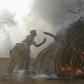 Kenya Wildlife Service rangers burn 15 tonnes of ivory confiscated from smugglers and poachers to mark the World Wildlife Day at the Nairobi National Park March 3, 2015. REUTERS/Thomas Mukoya