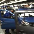 A worker inspects cars at Nissan's manufacturing plant in Rosslyn, outside Pretoria, file.