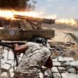 Libyan forces allied with the U.N.-backed government fire weapons during a battle with IS fighters in Sirte, Libya, July 21, 2016.