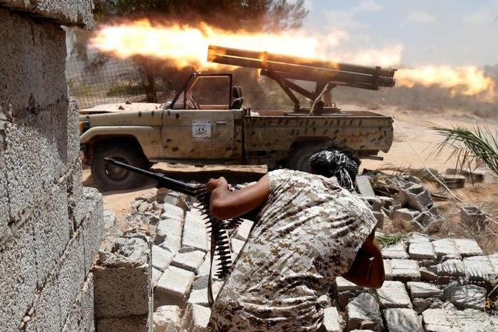 Libyan forces allied with the U.N.-backed government fire weapons during a battle with IS fighters in Sirte, Libya, July 21, 2016.