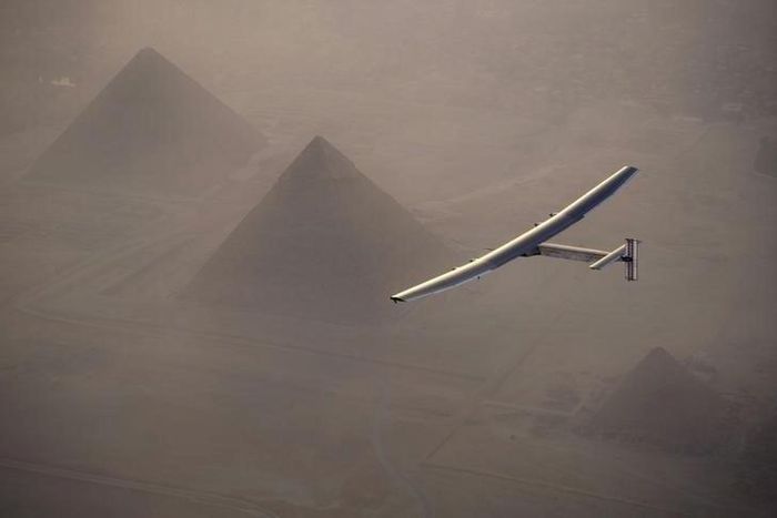 Solar Impulse 2, the solar powered plane, piloted by Swiss pioneer Andre Borschberg is seen during the flyover of the pyramids of Giza on July 13, 2016 prior to the landing in Cairo, Egypt in this photo released on July 13, 2016. Jean Revillard/SI2/Han...
