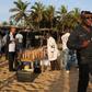 Emergency workers and security officers gather on the beach after an attack in Grand Bassam, Ivory Coast, March 13, 2016. REUTERS/Joe Penney