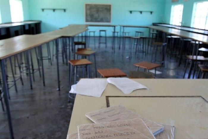 Books are seen in an empty classroom at Epworth Secondary School in Epworth near Harare, Zimbabwe, July 5, 2016.