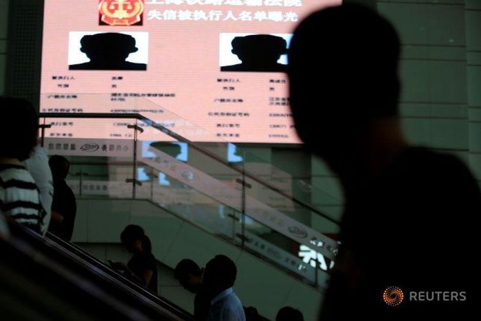 Shame on you! China uses public billboards to expose runaway debtors