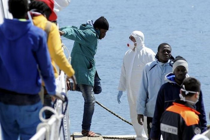 Italy raises wreck of migrant boat that sank, killing hundreds, in 2015