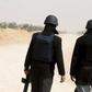 Tunisian polices officers stands guard during an operation to eliminate militants in a village some 50 km (31 miles) from the town of Ben Guerdane, Tunisia, near the Libyan border, March 10, 2016. REUTERS/Zoubeir Souissi