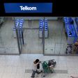 A shopper walks past a Telkom shop at a mall in Johannesburg February 26, 2016.