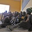 Children displaced as a result of Boko Haram attack in the northeast region of Nigeria, attend a class at Maikohi secondary school camp for internally displaced persons (IDP) in Yola, Adamawa State January 13, 2015.