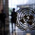 A United Nations logo is seen on a glass door in the Assembly Building at the United Nations headquarters in New York City September 18, 2015. REUTERS/Mike Segar