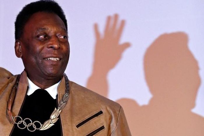 Brazilian soccer legend Pele poses for picture after receiving an Olympic necklace from President of the International Olympic Committee (IOC) Thomas Bach at the Pele Museum in Santos, Brazil June 16, 2016.