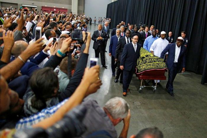 Worshipers and well-wishers take photographs as the casket with the body of the late boxing champion Muhammad Ali is brought for his jenazah, an Islamic funeral prayer, in Louisville, Kentucky, U.S. June 9, 2016.