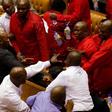 Party leader Julius Malema and members of his Economic Freedom Fighters (EFF) clash with Parliamentary security as they are evicted from the chamber in Cape Town, South Africa, May 17, 2016.