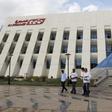 People leave the Telecom Egypt building at the Smart Village in the outskirts of Cairo, Egypt, October 27, 2015.