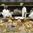 Workers arrange meat products inside the Nakumatt supermarket in the reopened Westgate shopping mall, in Kenya's capital Nairobi, July 18, 2015.     REUTERS/Thomas Mukoya