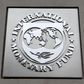 The International Monetary Fund (IMF) logo is seen at the IMF headquarters building during the 2013 Spring Meeting of the International Monetary Fund and World Bank in Washington, April 18, 2013