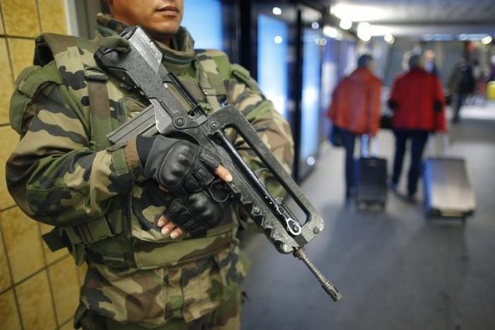 A French soldier patrols in the train station in Nantes, France, November 16, 2015 as security increases after last Friday's series of deadly attacks in Paris.   REUTERS/Stephane Mahe