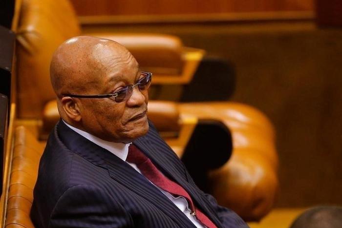 President Jacob Zuma looks on as members of Julius Malema's Economic Freedom Fighters (EFF) party raise objections before being evicted from Parliament during his question and answer session in Cape Town, South Africa, May 17, 2016.