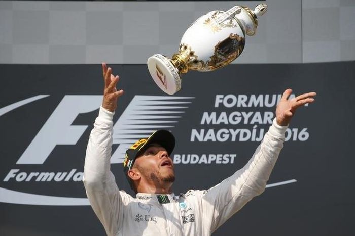 Mercedes' Lewis Hamilton celebrates after winning the race