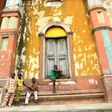 Children sit at the steps the Grand Mosque, a marvel of Afro-Brazilian ancient architecture in Benin's Porto-Novo 