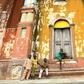 Children sit at the steps the Grand Mosque, a marvel of Afro-Brazilian ancient architecture in Benin's Porto-Novo 