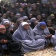 Kidnapped Chibok schoolgirls wearing the full-length hijab and praying at an undisclosed rural location.