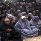 Kidnapped Chibok schoolgirls wearing the full-length hijab and praying at an undisclosed rural location.