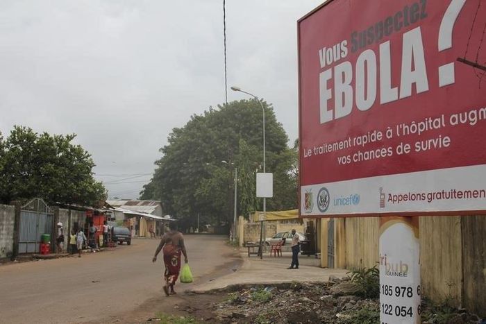 A billboard with a message about Ebola is seen on a street in Conakry, Guinea in this October 26, 2014 file photo. REUTERS/Michelle Nichols