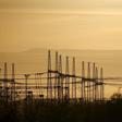 Pylons carry electricity from South African power utility Eskom's Koeberg nuclear plant near Cape Town, in this picture taken November 28, 2015.
