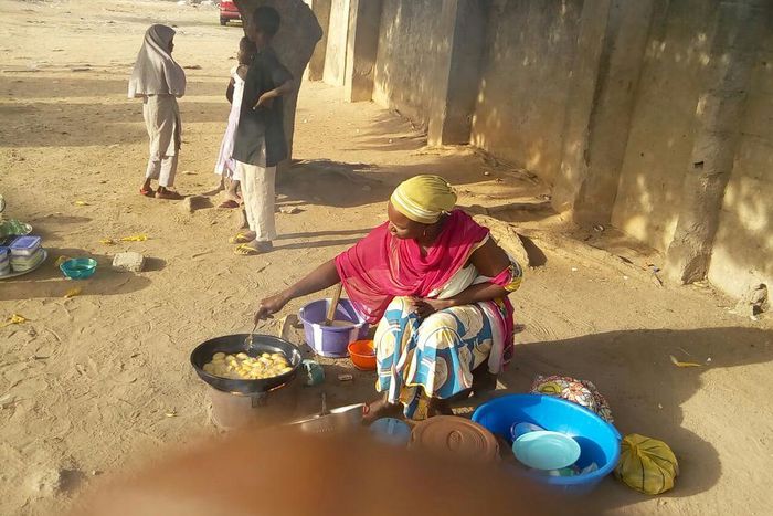 Mrs. Kwaramba Bitrus who lost five children and husband to Boko Haram struggling for survival through her beans cake business in Mubi town.