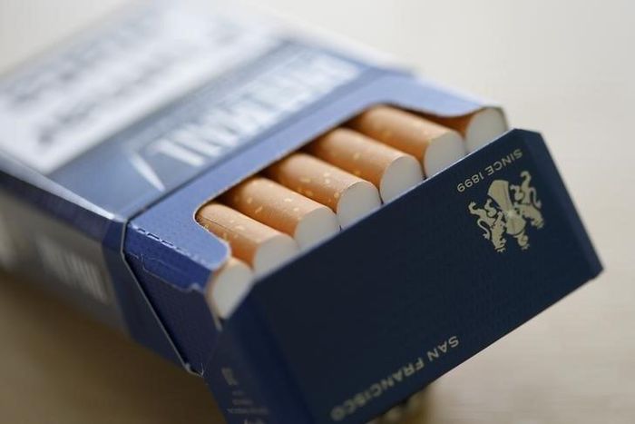 Pall Mall cigarettes are seen after the manufacturing process in the British American Tobacco Cigarette Factory (BAT) in Bayreuth, southern Germany, April 30, 2014. REUTERS/Michaela Rehle